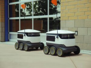 pexels-photo-8566527-8566527 Futuristic autonomous robots designed for efficient outdoor food delivery.